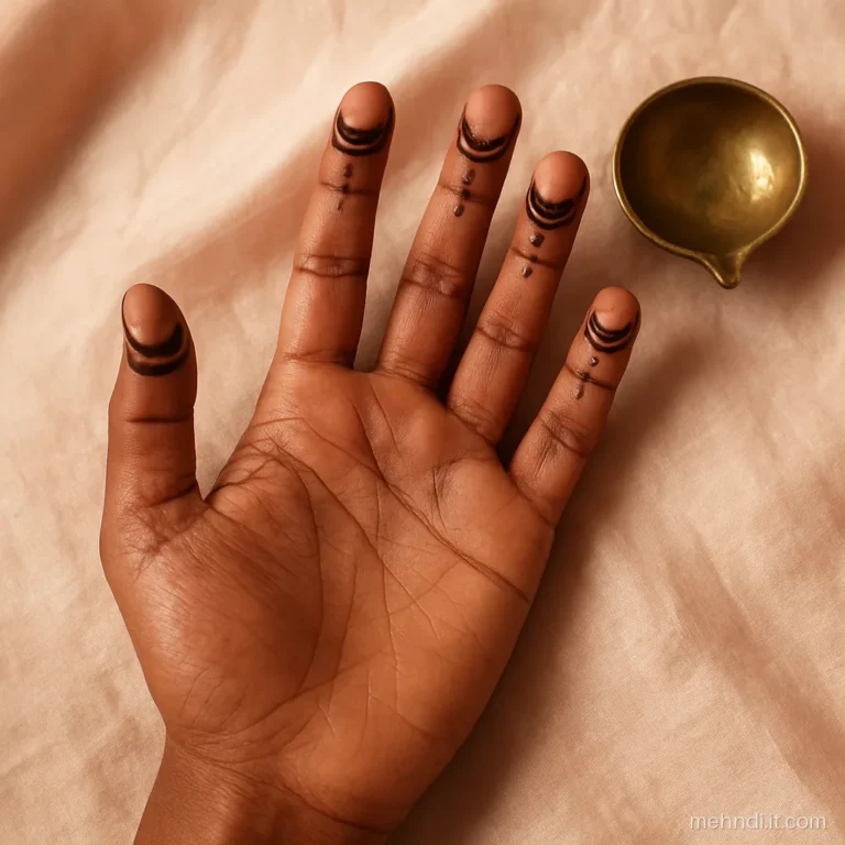Fingertips with half-moon chand arcs and dotted edges on a plain palm